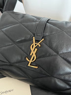 Quilted dark leather flap bag with gold YSL monogram hardware at center
