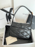 Quilted dark leather shoulder bag with top handles and gold YSL monogram on the front