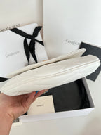 YSL quilted mini handbag, white, side angle with long flap and stitched pattern