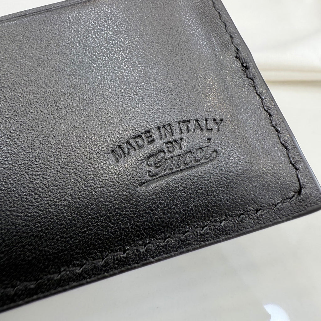 Gucci leather wallet stamp detail reading "MADE IN ITALY".
