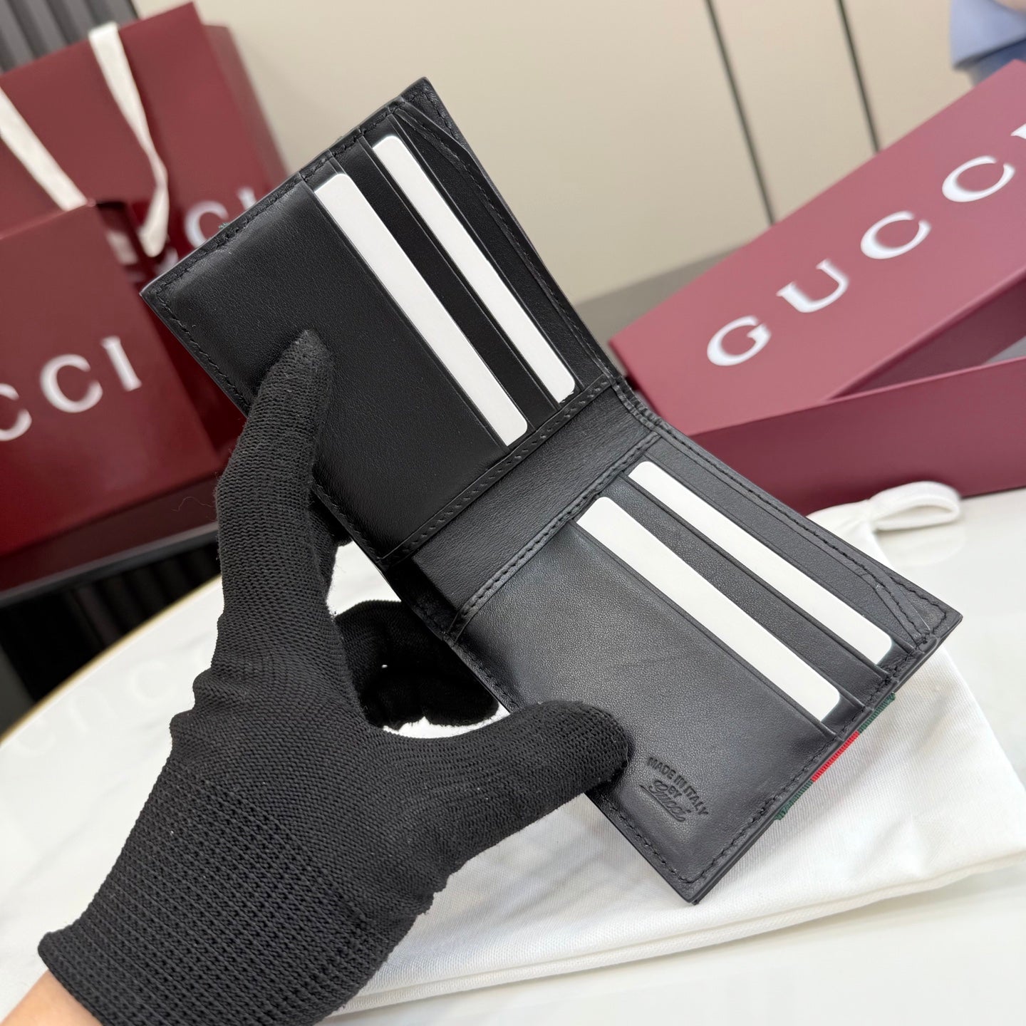Black leather card holder with Web stripe and multiple card slots
