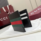 Gucci small leather wallet, open card slots view with green-red-green stripe band.
