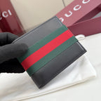 Gucci small leather wallet, close-up of black with green-red-green web stripe.