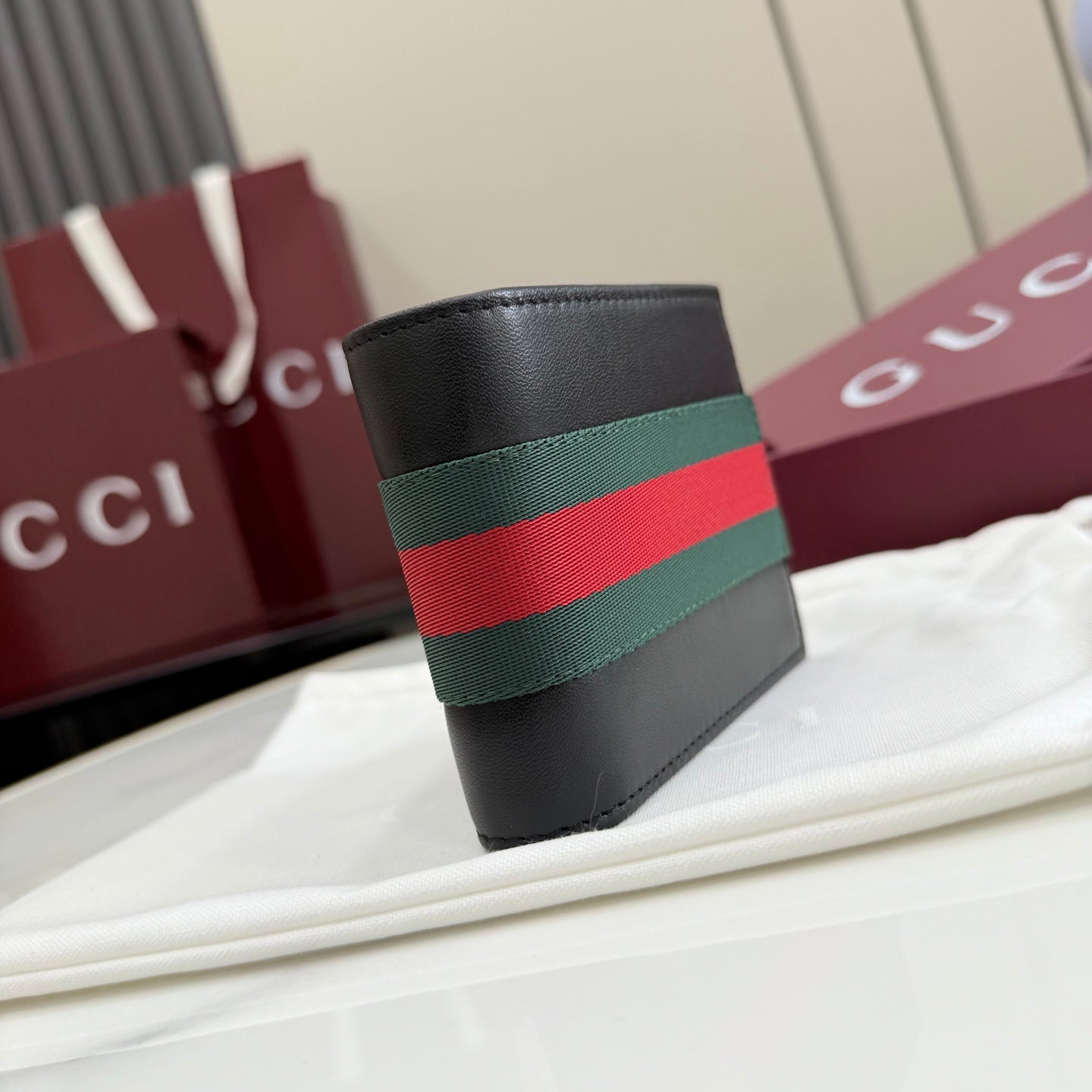 Black leather card holder with green and red Web stripe