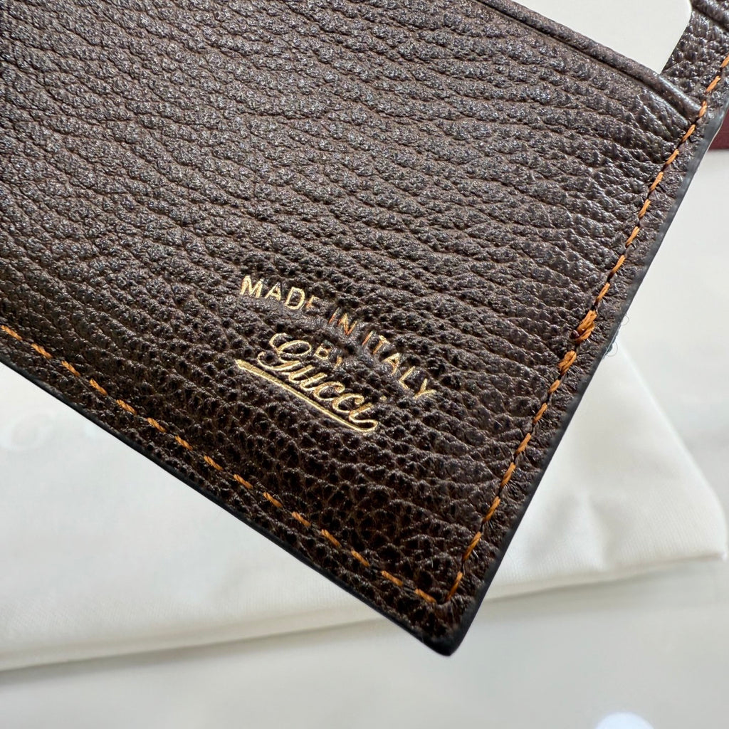 Gucci card case label with 'MADE IN ITALY' and Gucci logo