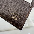 Gucci card case label with 'MADE IN ITALY' and Gucci logo