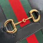 Gold-tone clasp detail on black leather Gucci strap with green and red stripe