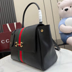 Black leather Gucci tote bag with web stripe, front emblem, and gold hardware
