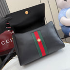 Black leather Gucci crossbody bag with green and red web stripe and front button