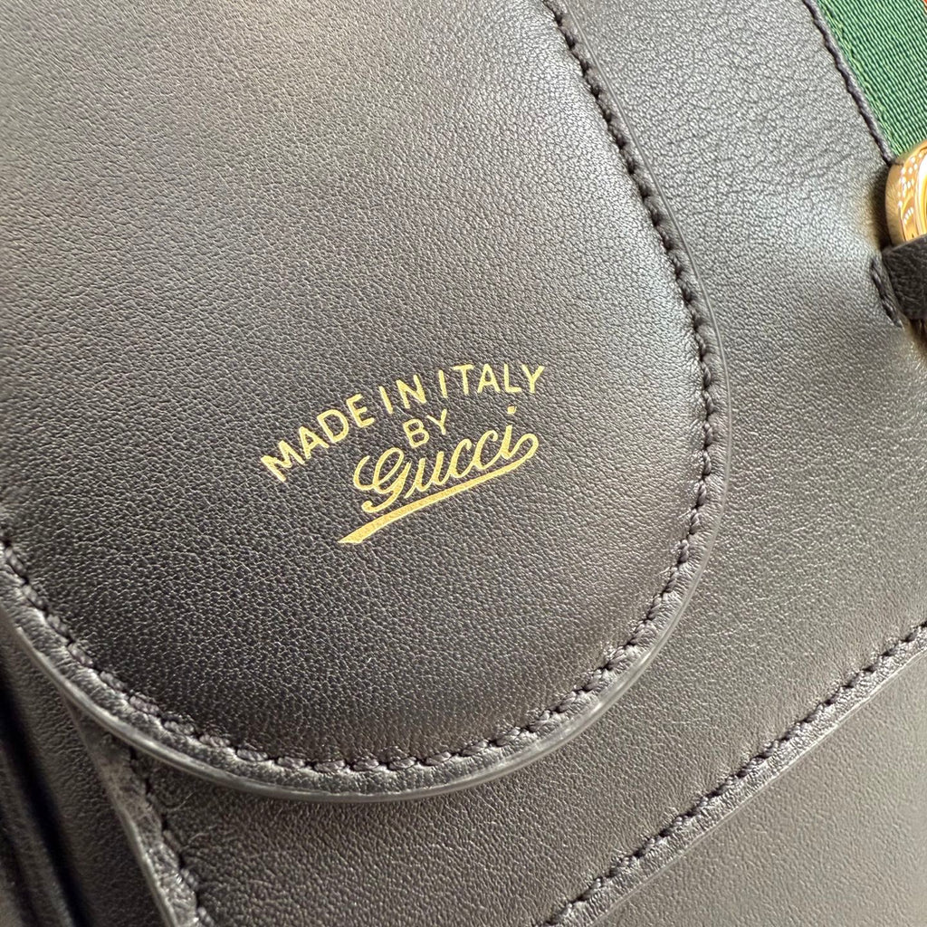 Gucci leather bag label, dark with MADE IN ITALY and Gucci logo stitch detail