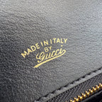 Gold 'Made in Italy' stamp on black leather Gucci bag