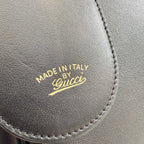 Gucci bag leather stamp reading “MADE IN ITALY” with Gucci logo