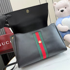 Gucci bag with dark leather and green-red stripe panel, open top interior