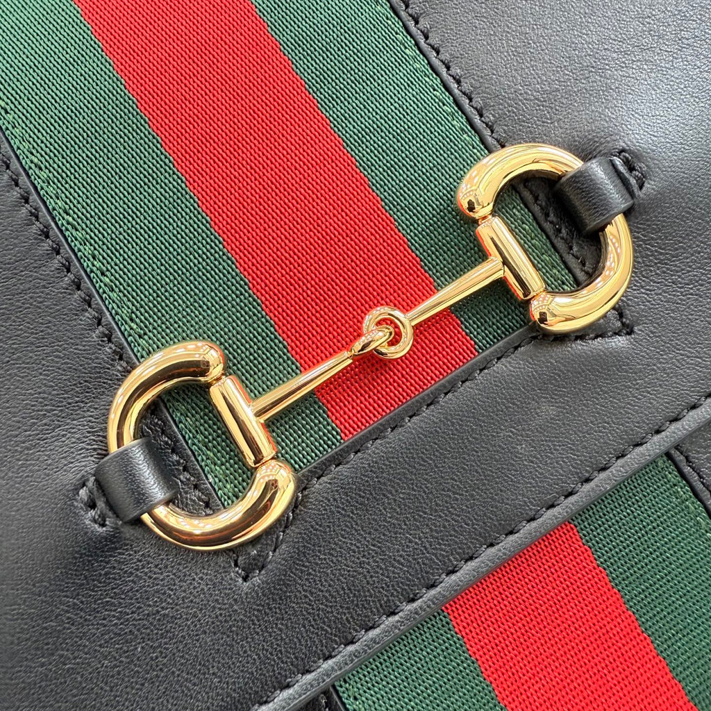 Gucci bag stripe detail with green and red webbing and gold D-ring clasp