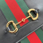 Gucci bag stripe detail with green and red webbing and gold D-ring clasp