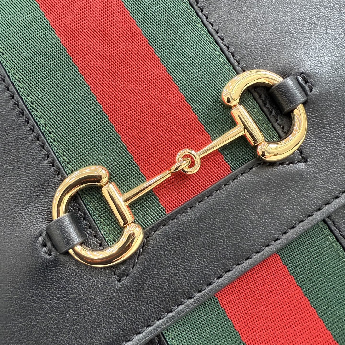 Gucci bag stripe detail with green and red webbing and gold D-ring clasp