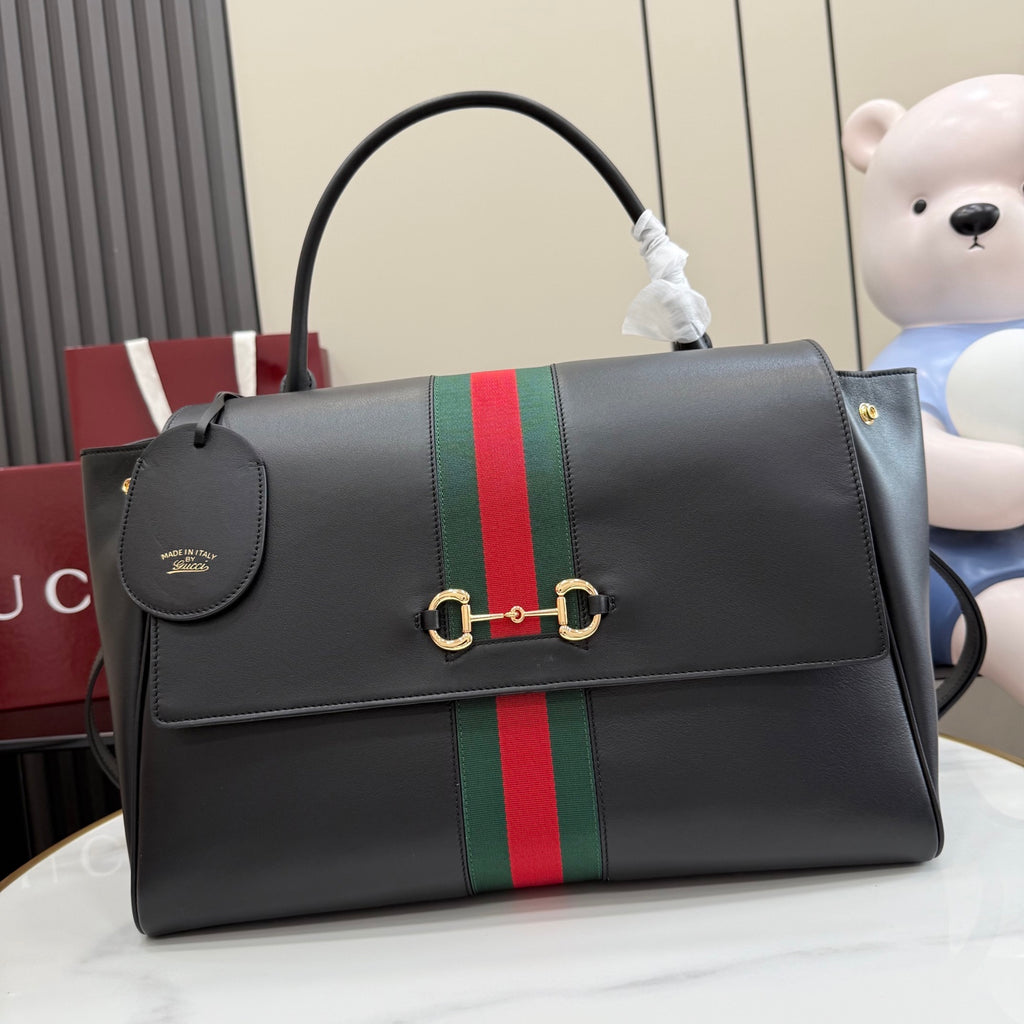 Gucci bag in dark leather with green-red stripe, flap and gold clasp