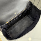 Gucci bag interior with fabric lining and gold zipper pull, viewed from inside