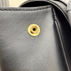 Gucci bag exterior gold-tone snap button on textured leather