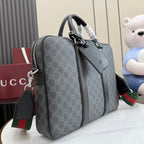 GG monogram top-handle bag with side zipper pocket and adjustable shoulder strap.