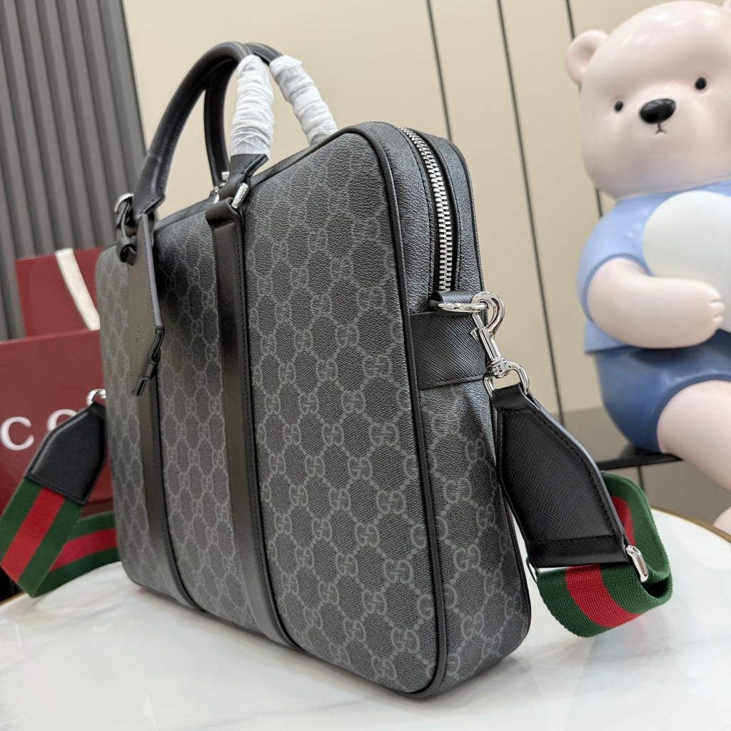 GG monogram top-handle bag side view with two-tone shoulder strap.