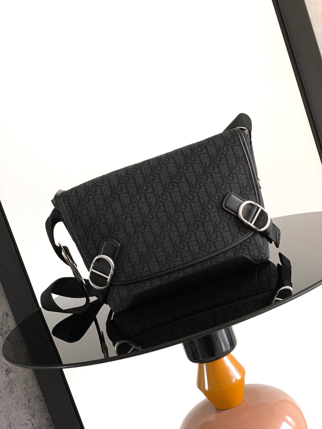 Dior patterned crossbody bag with adjustable strap and silver-tone rings