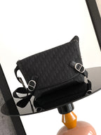 Dior patterned crossbody bag with adjustable strap and silver-tone rings