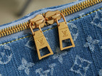 Blue monogram bag with gold zipper pulls and LV padlock-style hardware