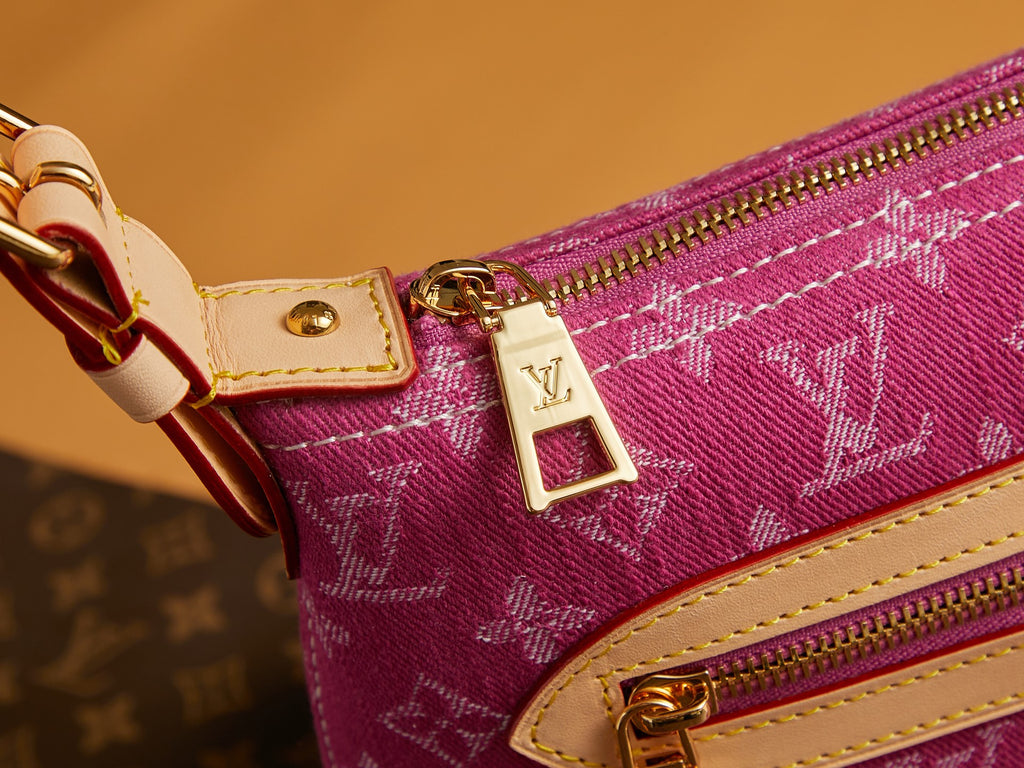 Louis Vuitton bag pink monogram canvas with gold zipper pull and LV charm on strap