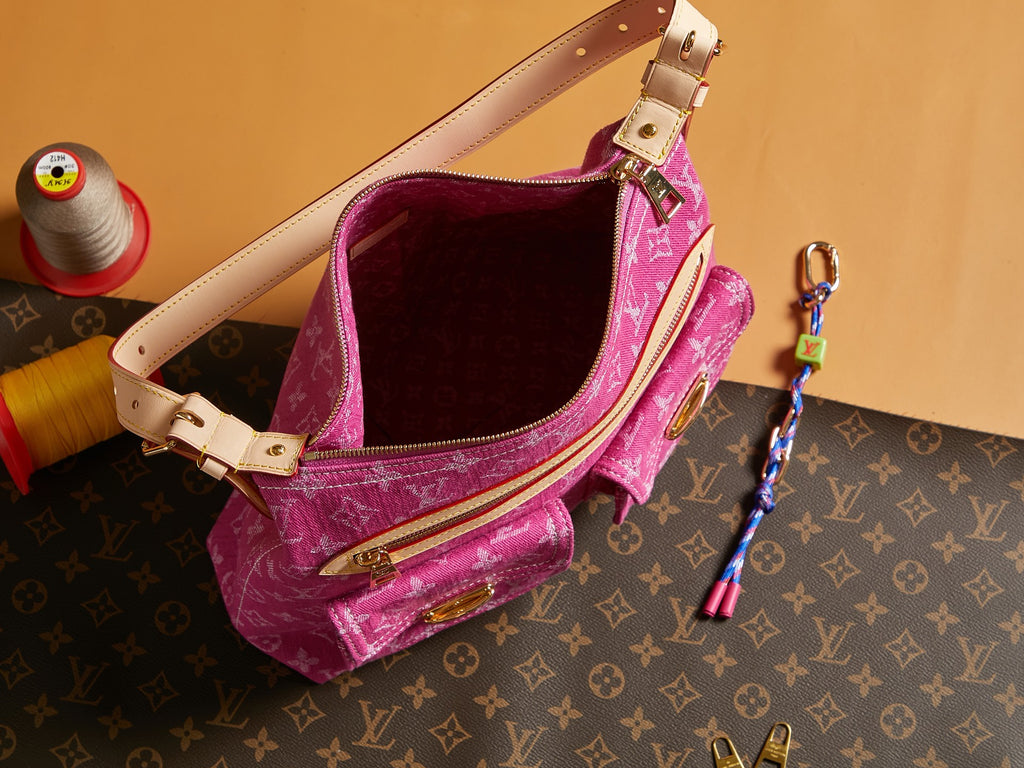 Louis Vuitton bag pink monogram canvas with zip top, beige shoulder strap, and gold rings