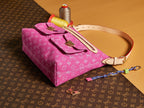 Louis Vuitton bag pink monogram canvas with front buckle strap and top handle