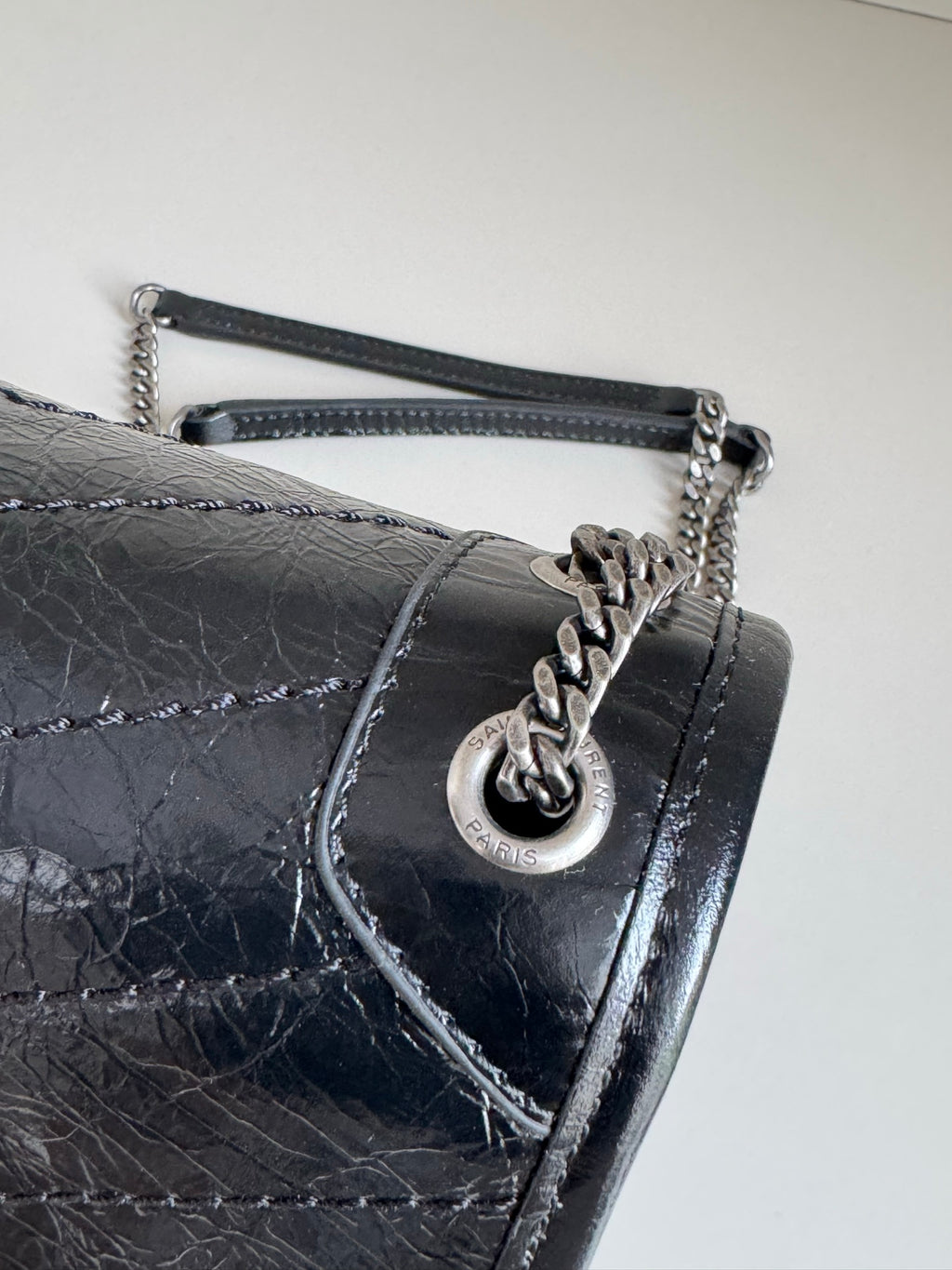 Black leather flap shoulder bag with YSL charm clasp and chain strap
