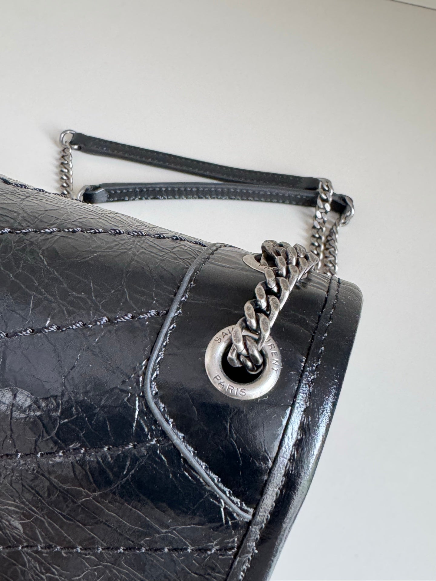Black leather flap shoulder bag with YSL charm clasp and chain strap