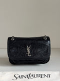 Black leather flap shoulder bag with chain strap, YSL logo, and embossed texture