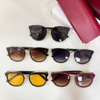 Assorted sunglasses on display: black, tortoiseshell, purple, and brown frames