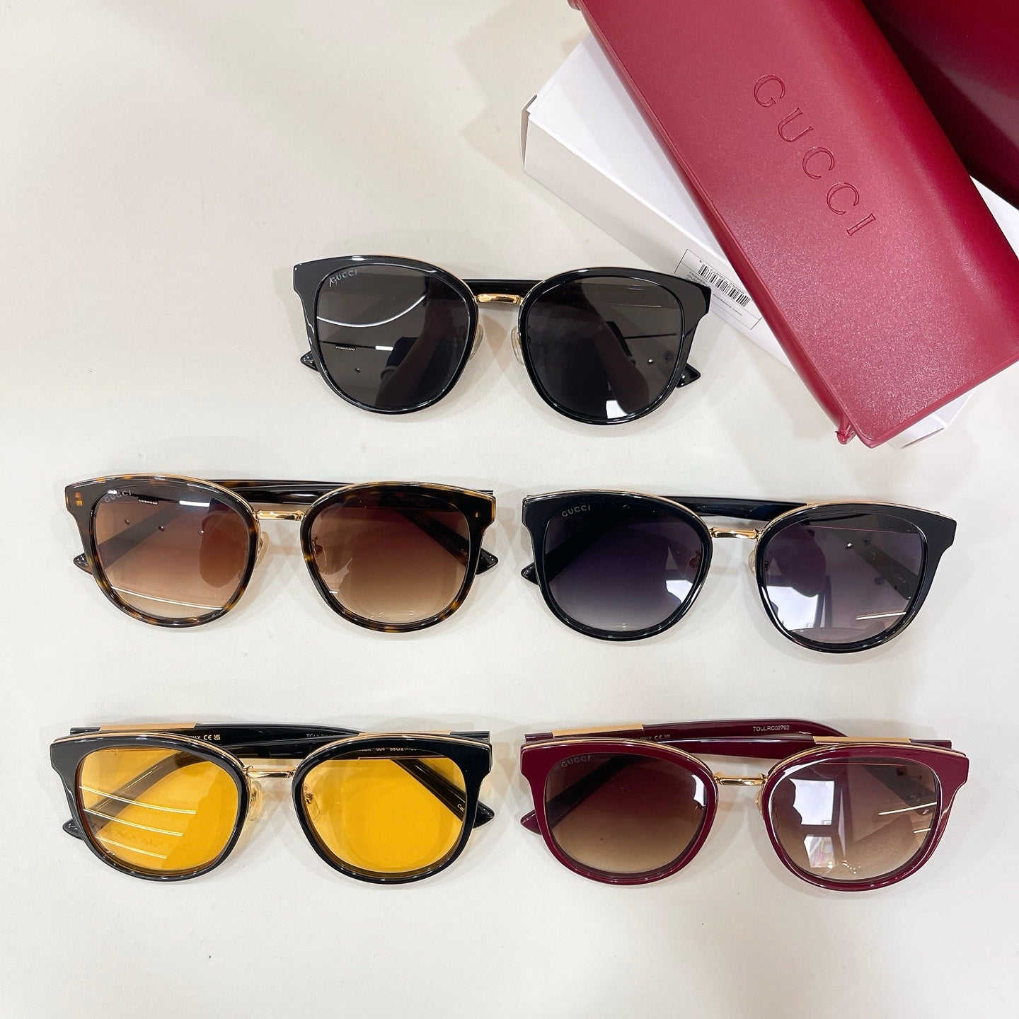 Assorted sunglasses on display: black, tortoiseshell, purple, and brown frames