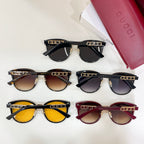 Assorted sunglasses with multiple frame and lens colors, gold logo on temples