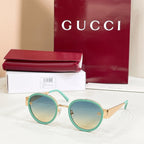 Round sunglasses with mint-green frames and green-tinted lenses
