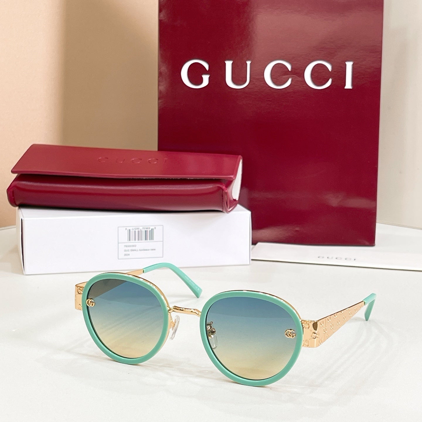 Round sunglasses with mint-green frames and green-tinted lenses