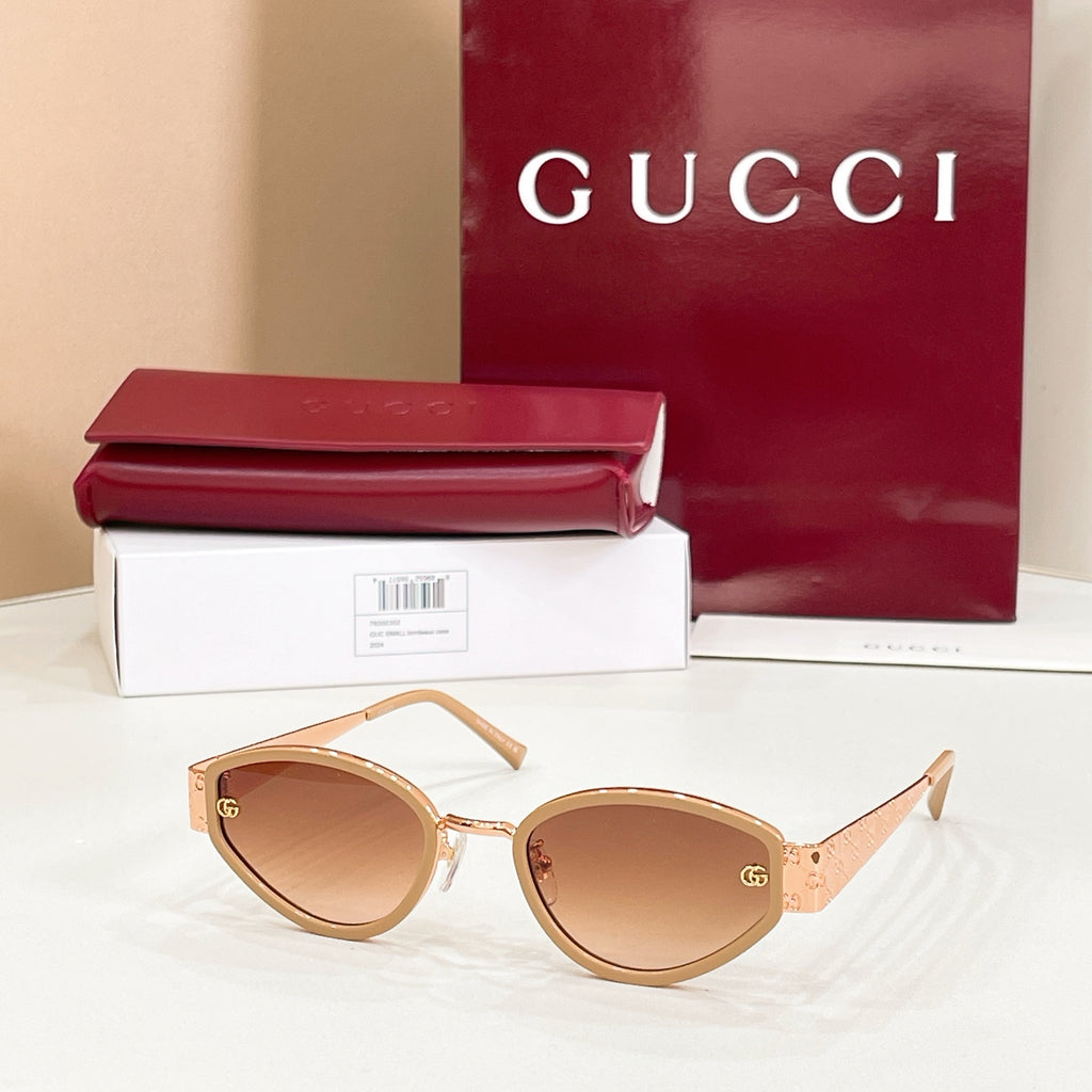 Sunglasses with gold frame and warm brown lenses