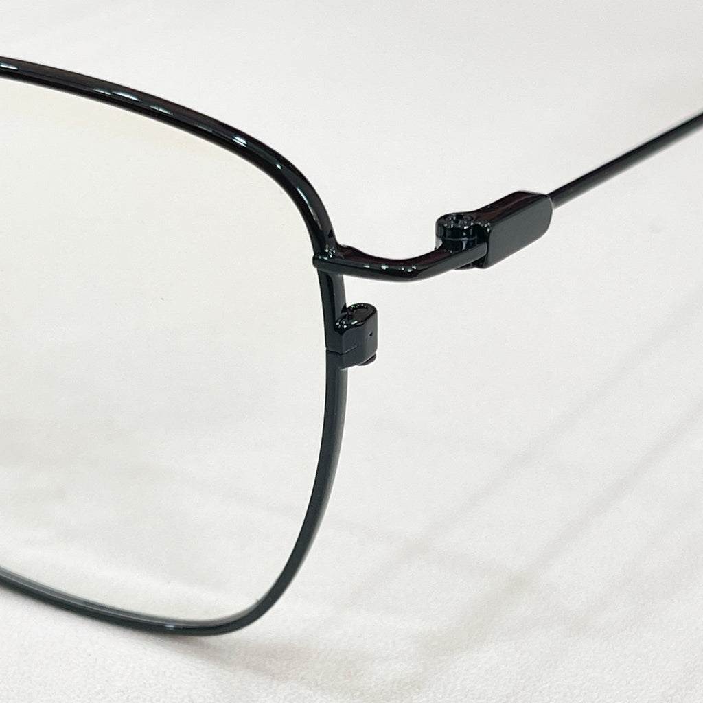 Black rectangular eyeglass frame with curved temple and hinge detail