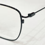 Black rectangular eyeglass frame with curved temple and hinge detail