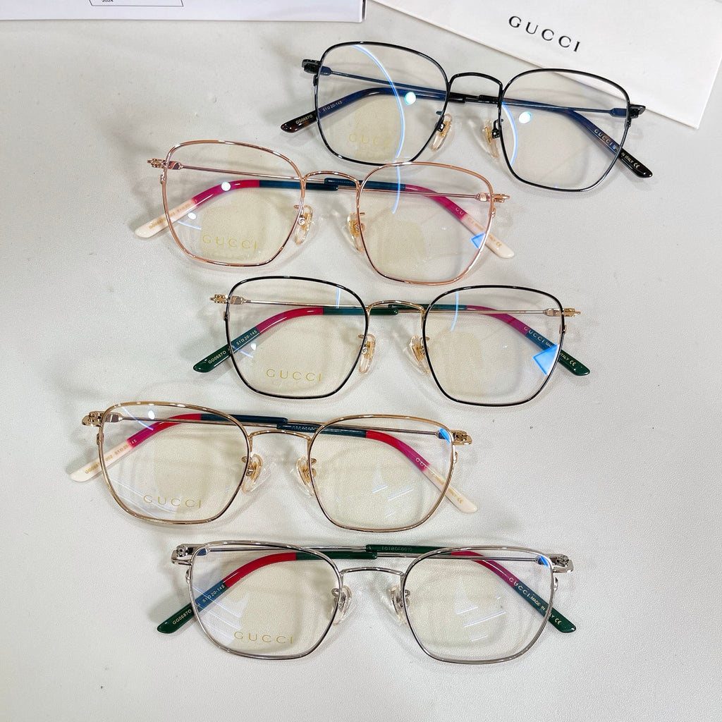 Set of four rectangular eyeglasses with mixed metal frames and colored temples