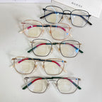 Set of four rectangular eyeglasses with mixed metal frames and colored temples