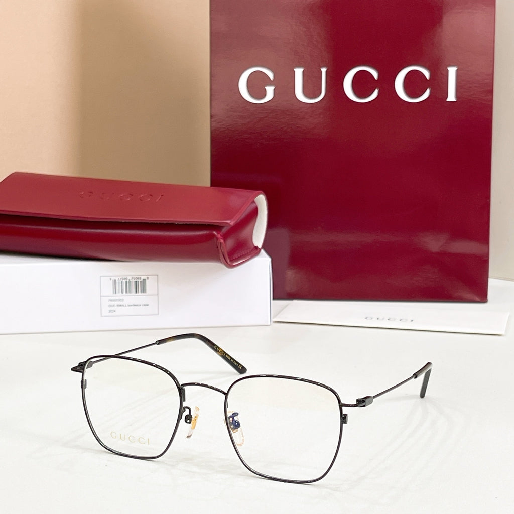 Rectangular eyeglasses with dark/black frame and metal temple hinges