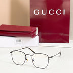 Rectangular eyeglasses with dark/black frame and metal temple hinges