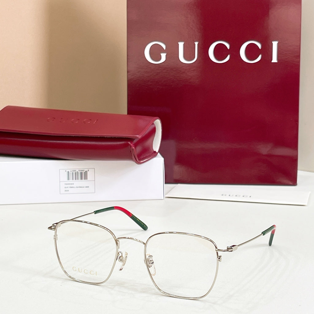 Rectangular eyeglasses with silver frame and green temple accents