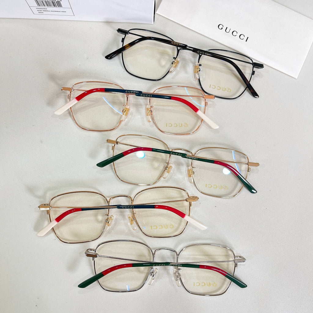 Assorted rectangular eyeglasses with mixed frames and red, green, and blue temple accents