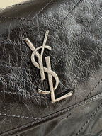 Saint Laurent YSL metal logo on textured black leather flap