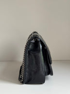 Saint Laurent black leather mini flap bag with chain strap on side